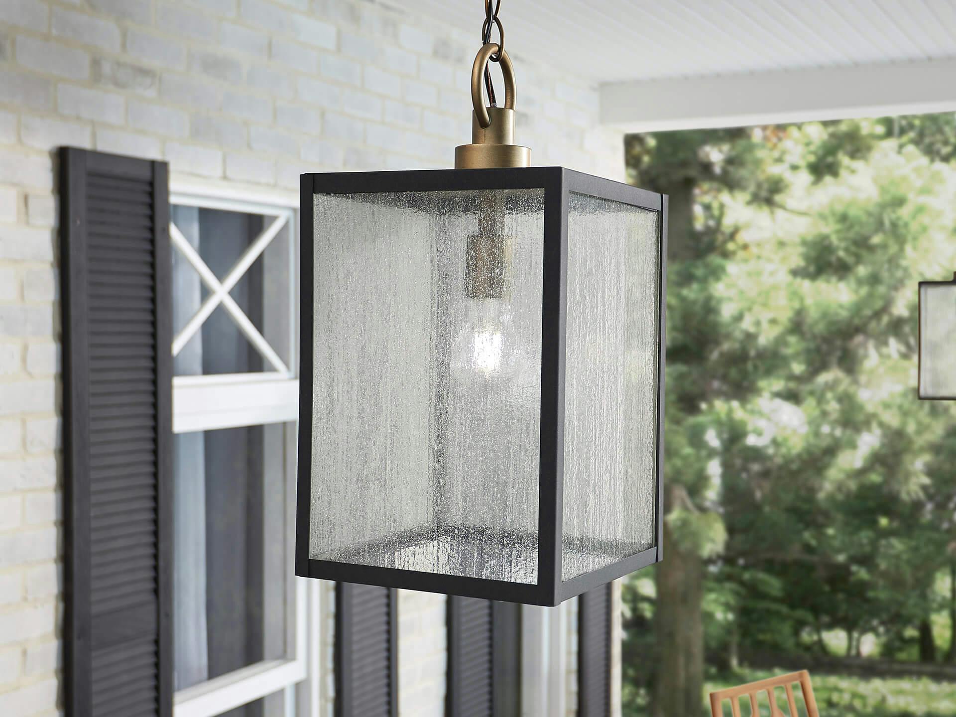 Close up of a lahden pendant light in a black finishing hanging on a porch