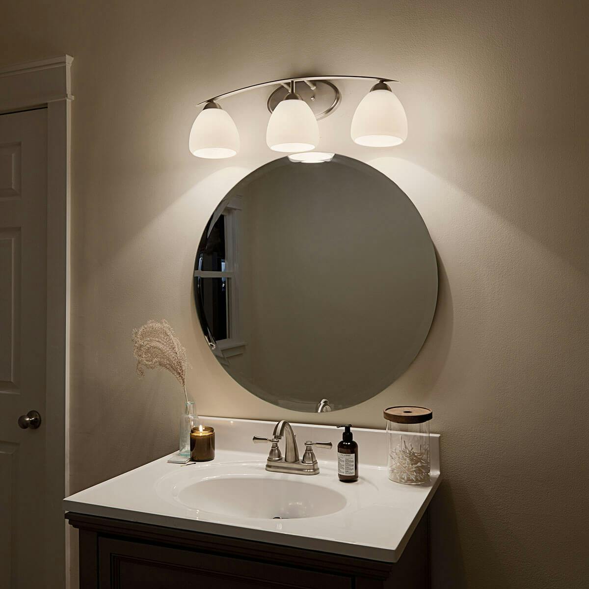 Night time Bathroom featuring Calleigh vanity light 45119NI