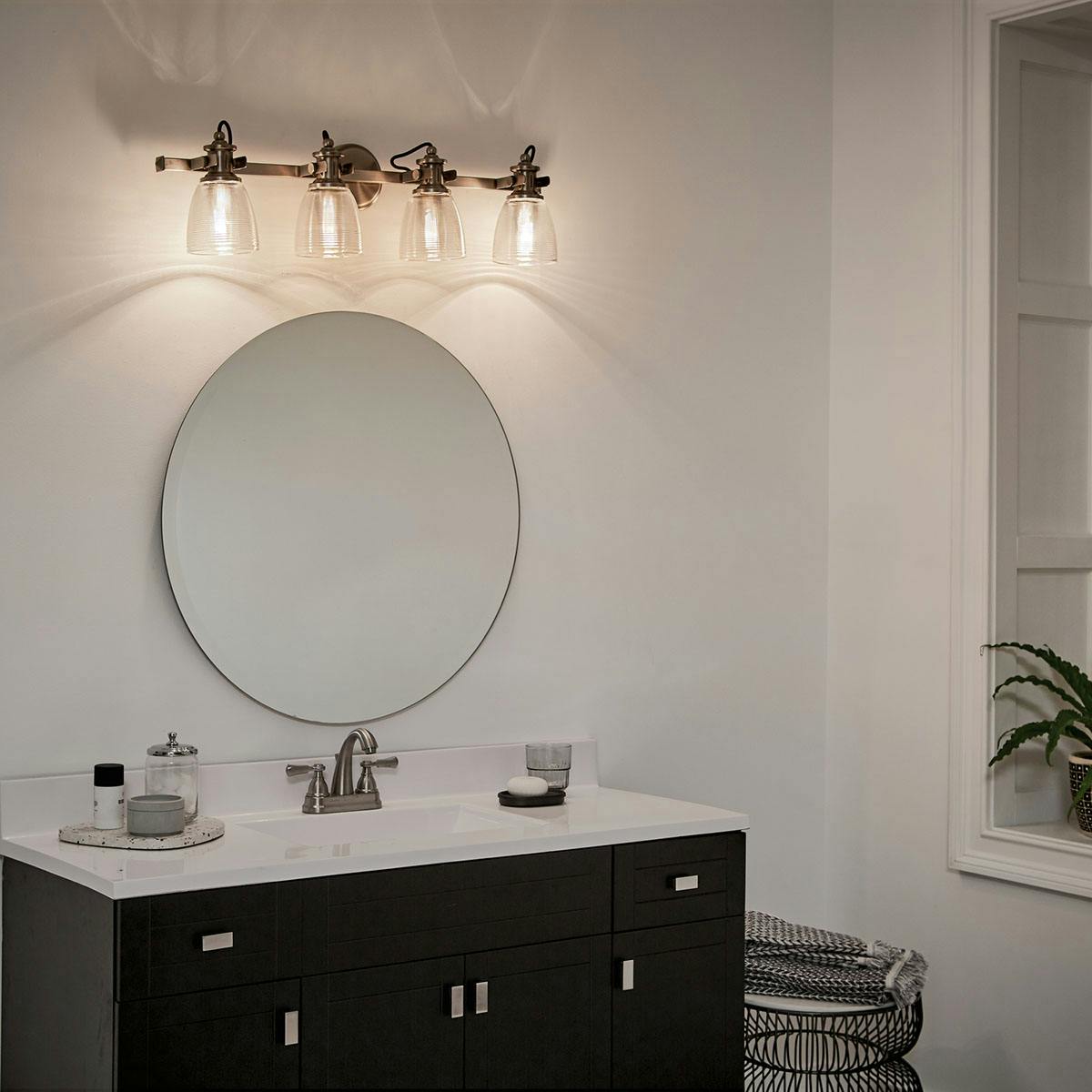 Night time Bathroom featuring Flagship vanity light 45874CLP