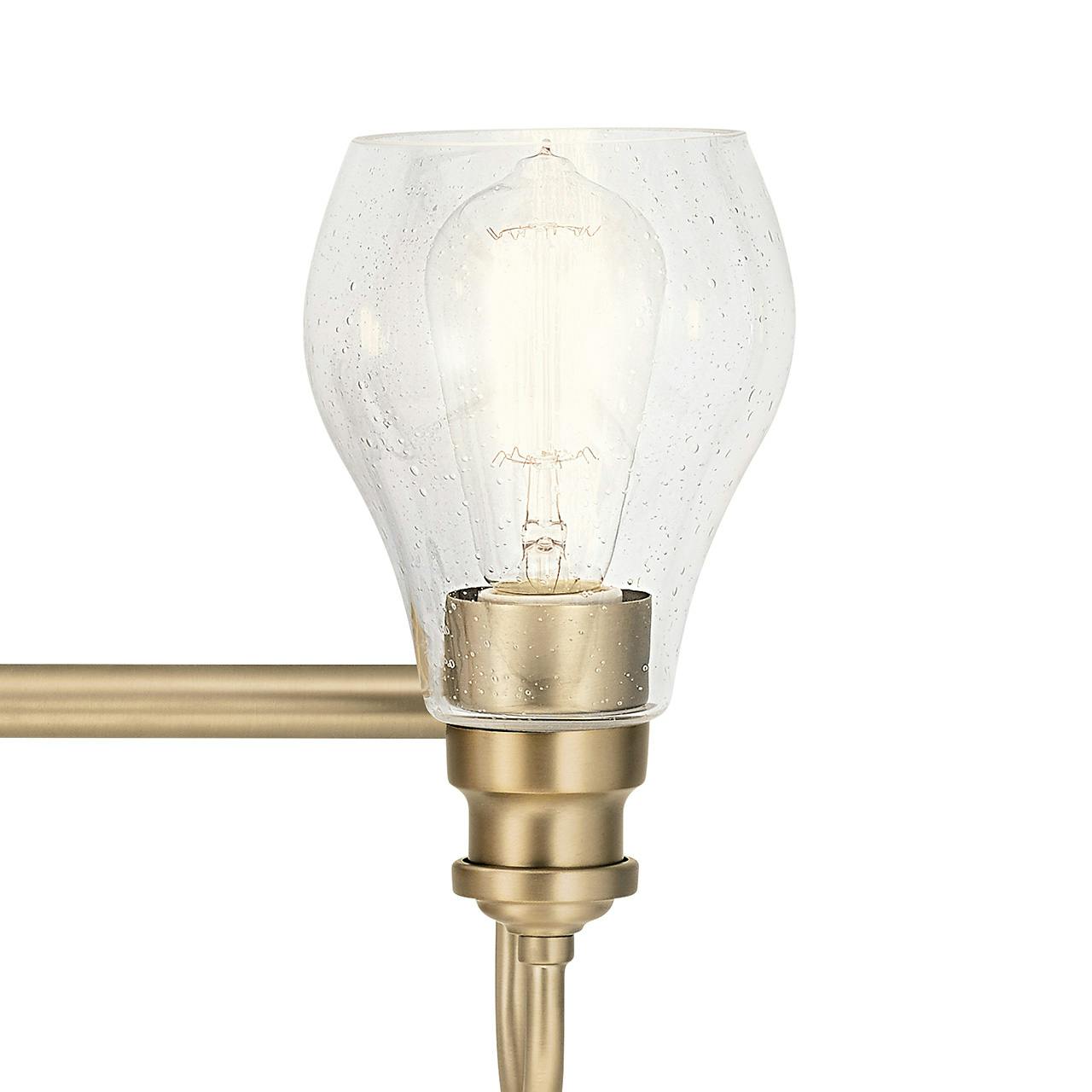 Close up view of the Greenbrier 3 Light Vanity Light Bronze on a white background