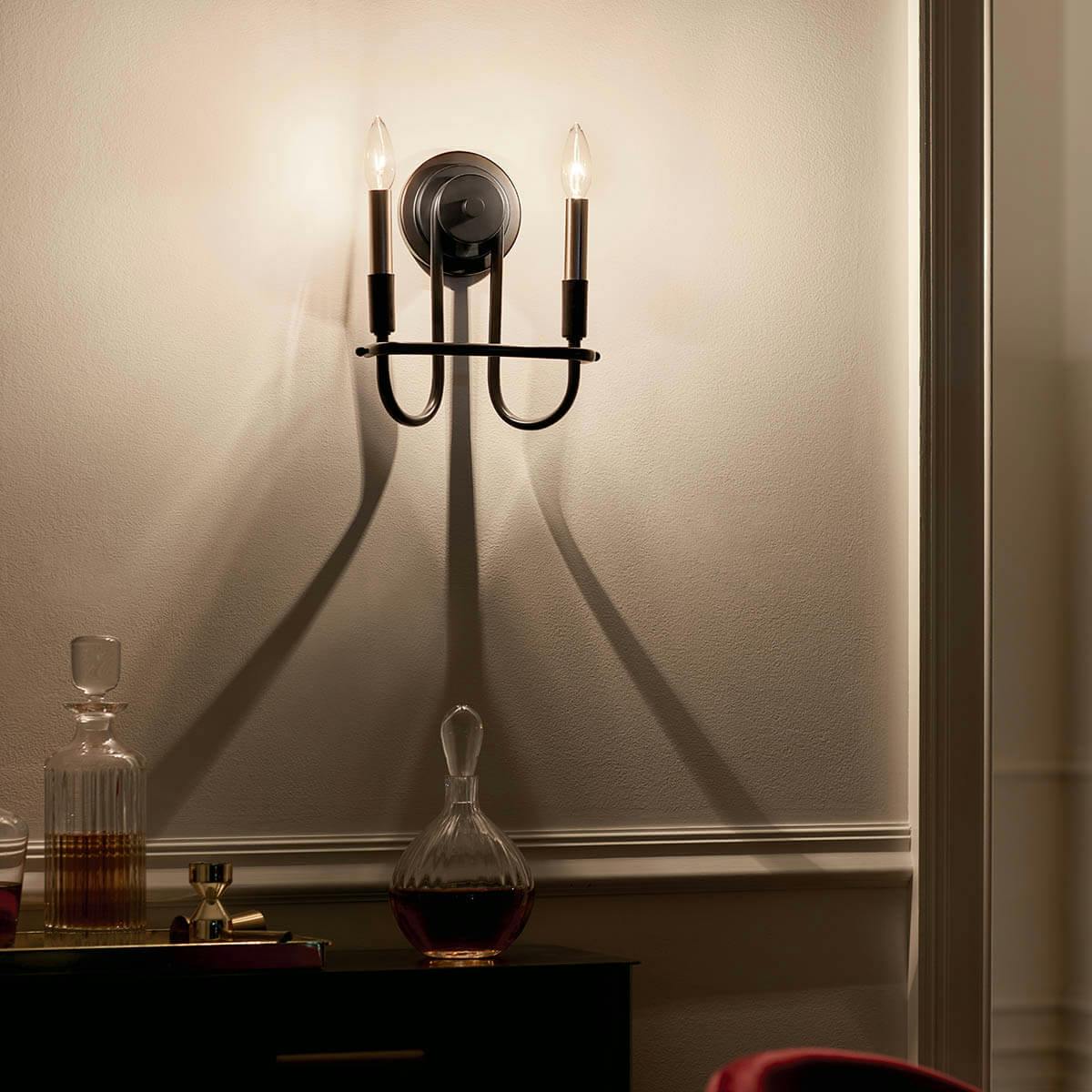 Night time dining room with Capitol Hill 2 Light Wall Sconce Black