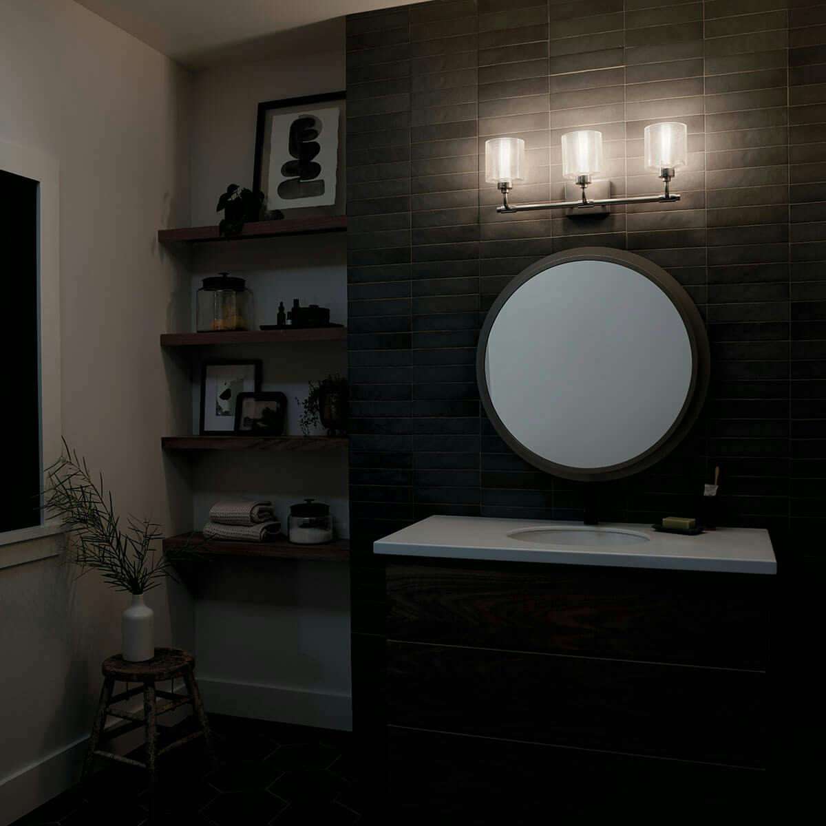 Night time Bathroom featuring Harvan vanity light 55107SN