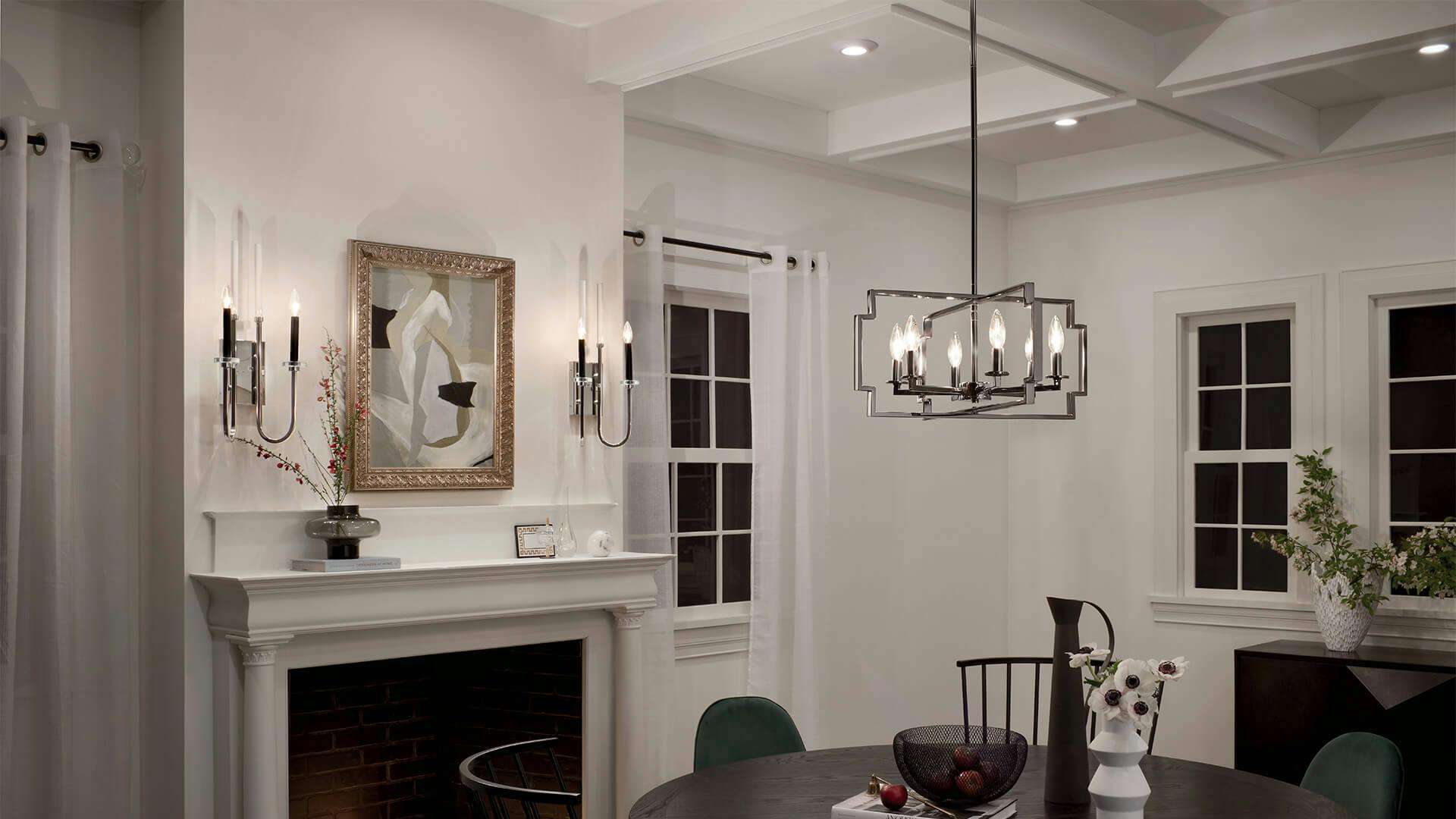 Modern dining room at night with Kadas wall sconces and Horizon chandelier