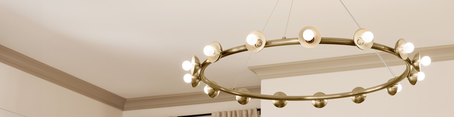 Palta 15-light chandelier in champagne bronze finish hanging from a white ceiling