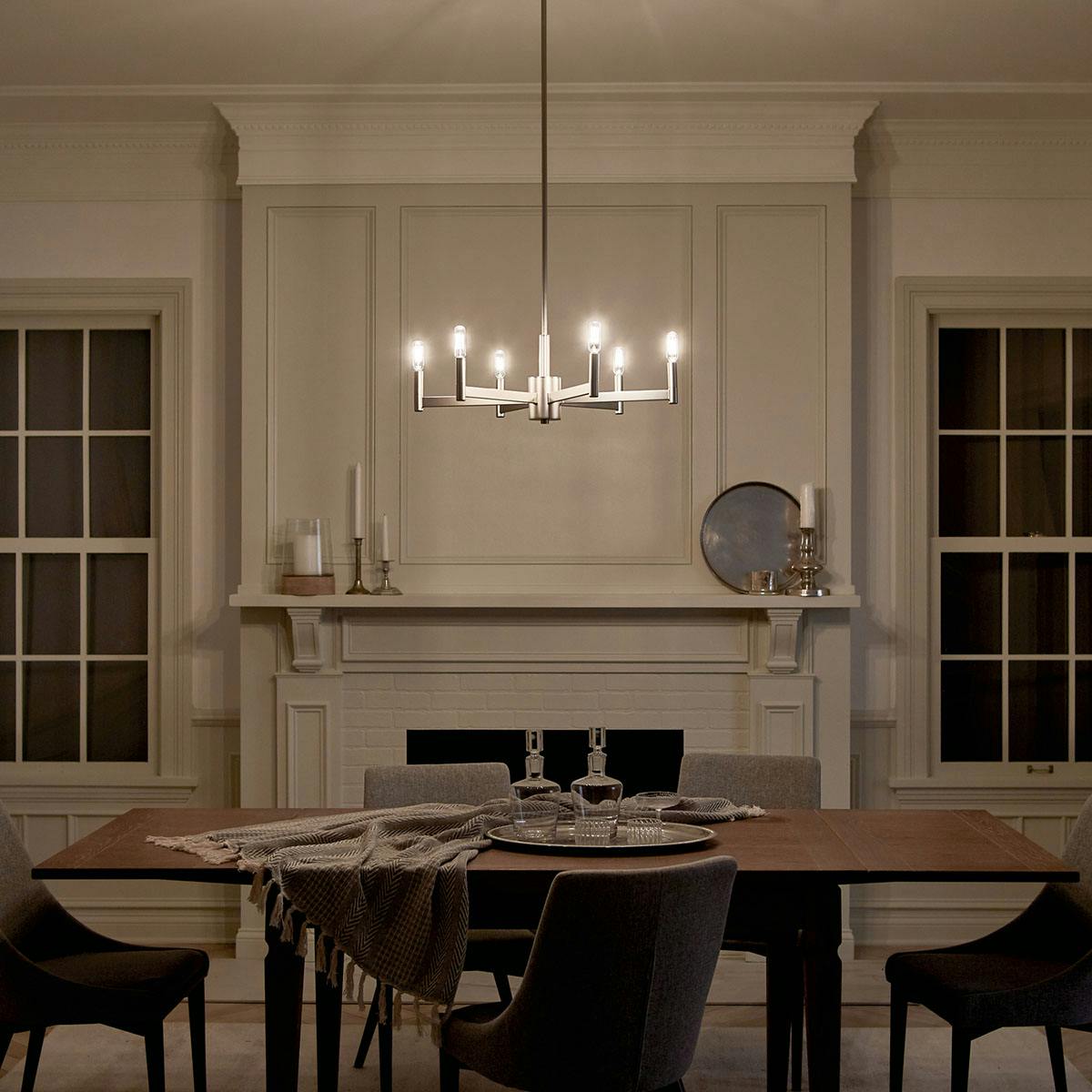 Night time dining room image featuring Erzo chandelier 43859SN