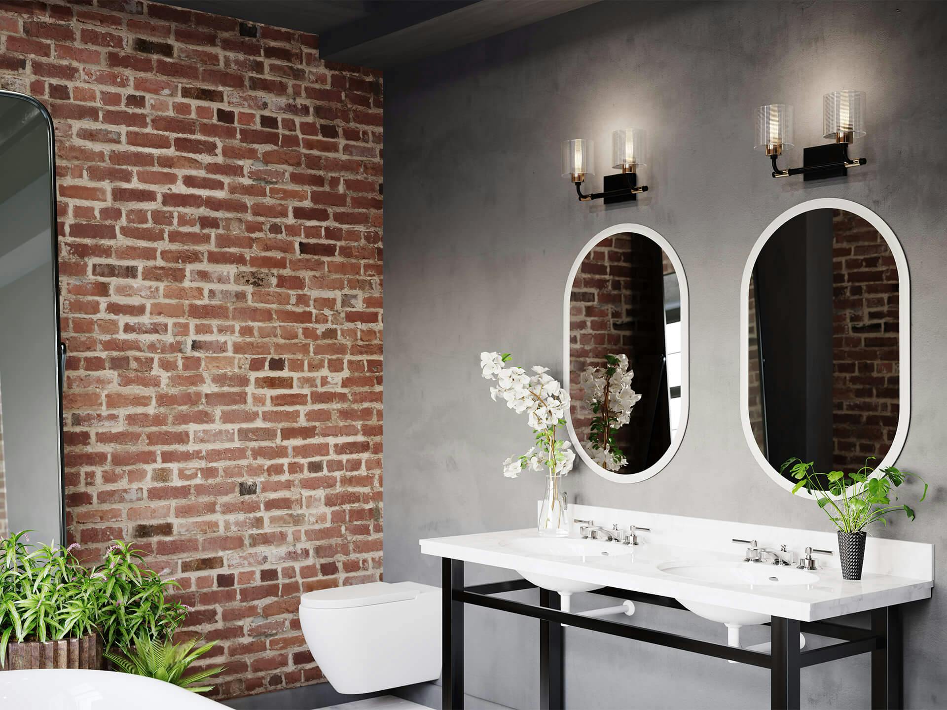 Brick wall bathroom with Harvan vanity lights and Menillo mirror