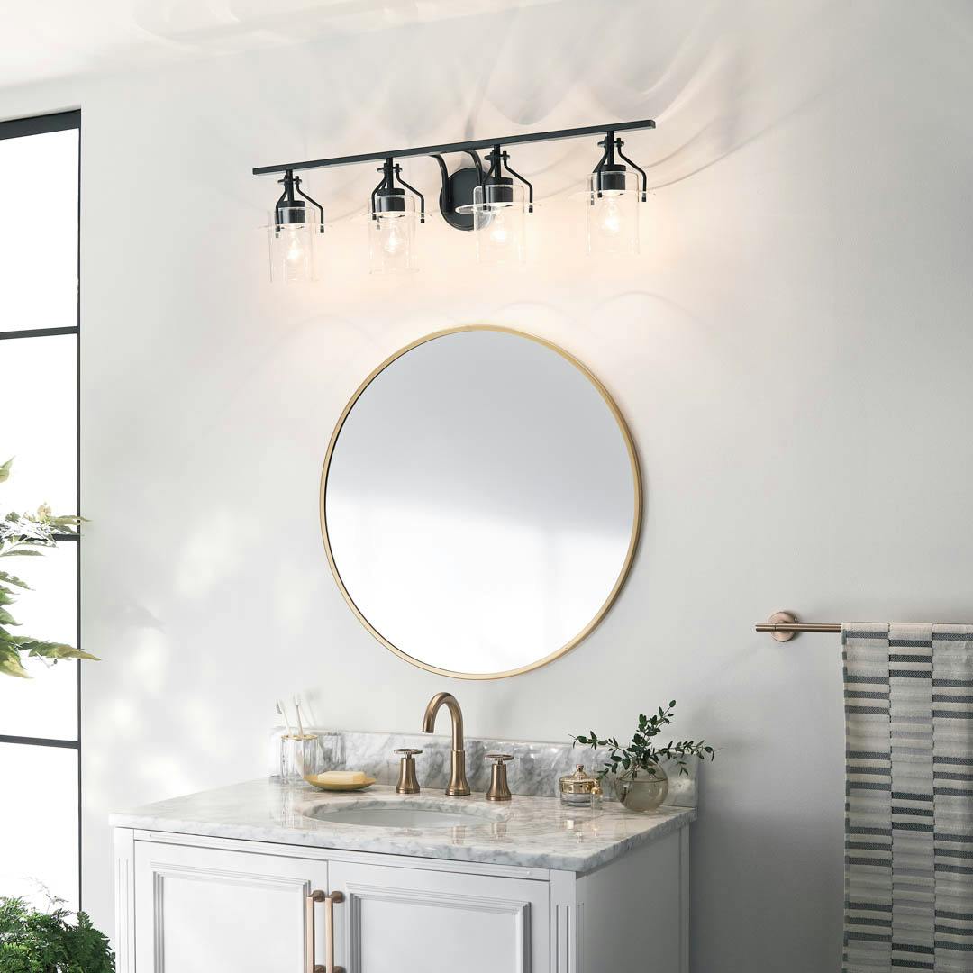 Day time bathroom with Everett 34.25 Inch 4 Light Vanity Light with Clear Glass in Black