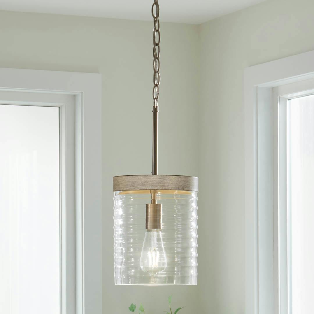 Day time kitchen with Maritime 1 Light Mini Pendant in Brushed Nickel and Distressed Antique Gray with Ribbed Glass