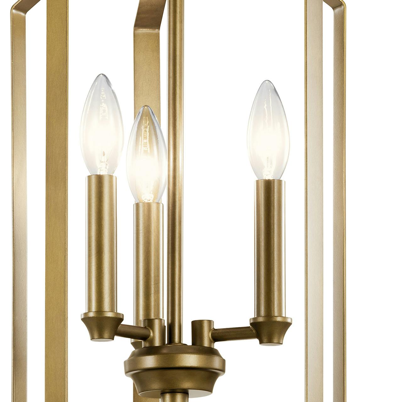 Close up view of the Morrigan 21" 3 Light Foyer Pendant Brass on a white background