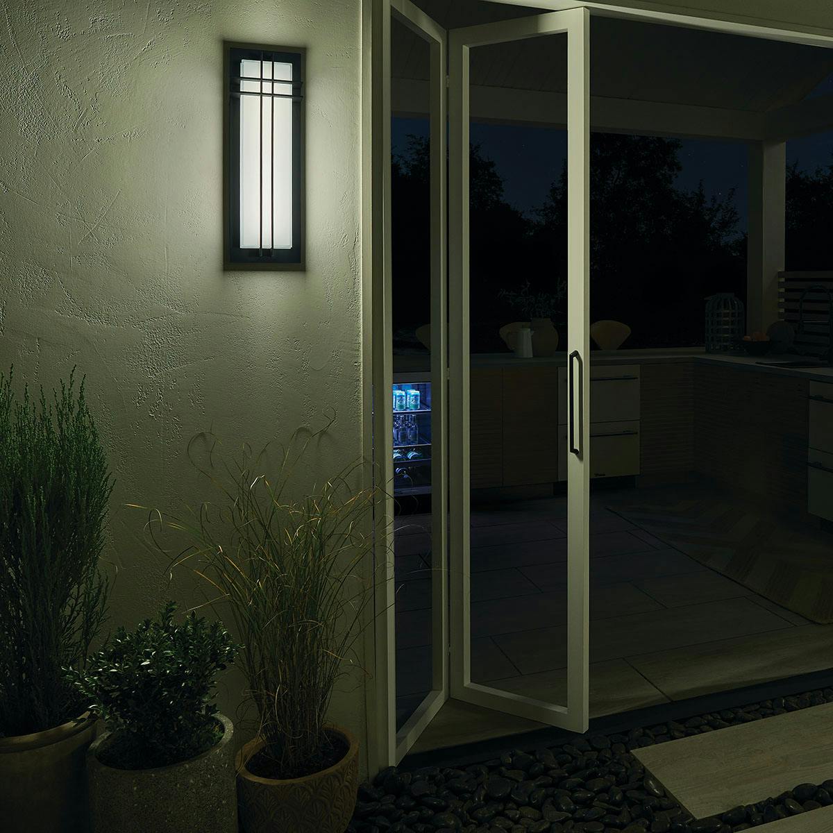 Night time Exterior image featuring Manhattan outdoor wall light 49298BKTLED