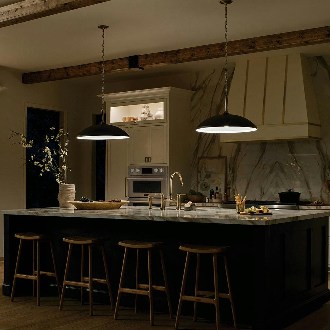 Kitchen at night light with the Delarosa 20 Inch 1 Light Pendant in Black and Champagne Bronze