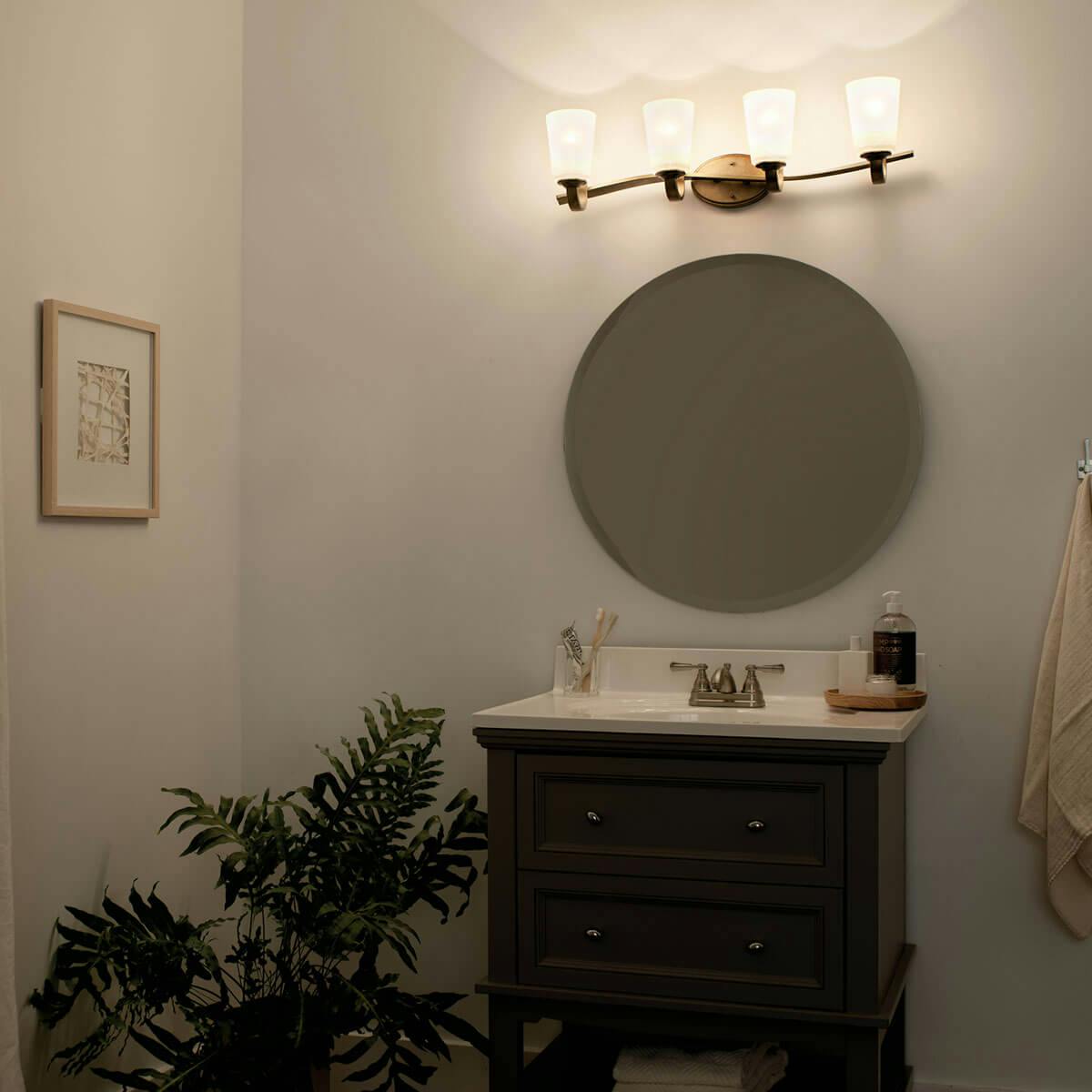 Night time Bathroom featuring Oxby vanity light 37519NBR