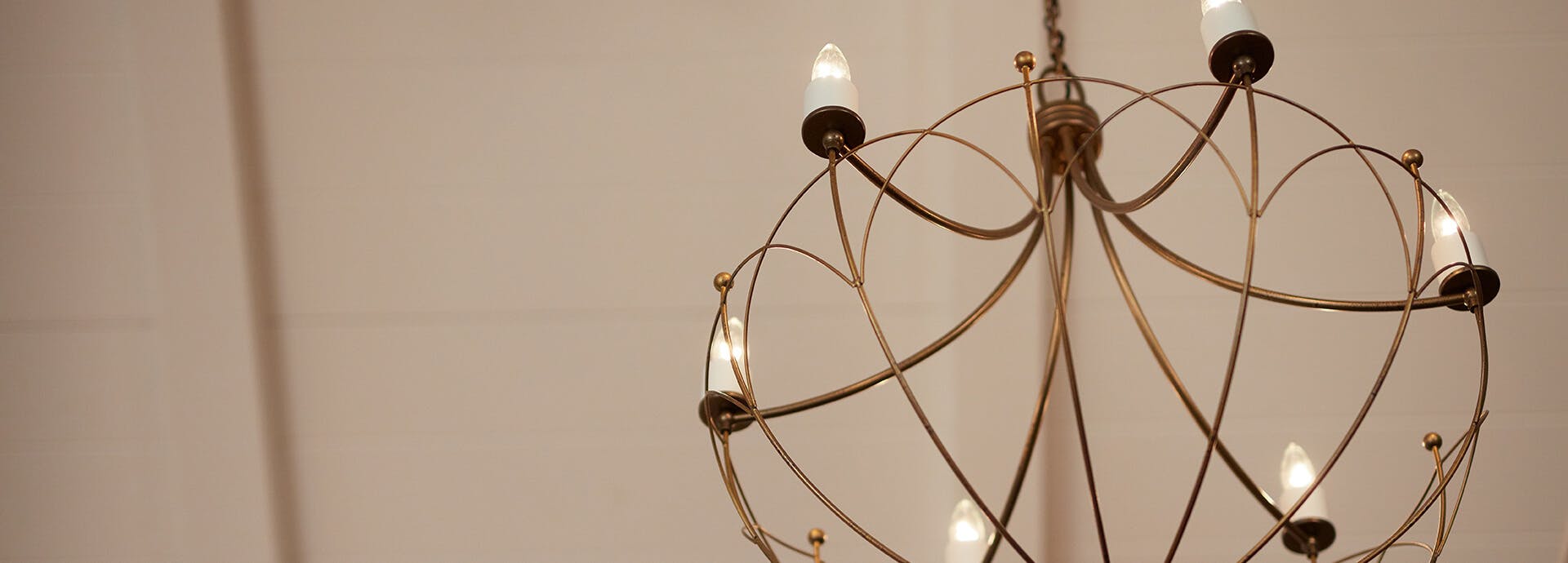 Close up of a Topiary chandelier in gold finish