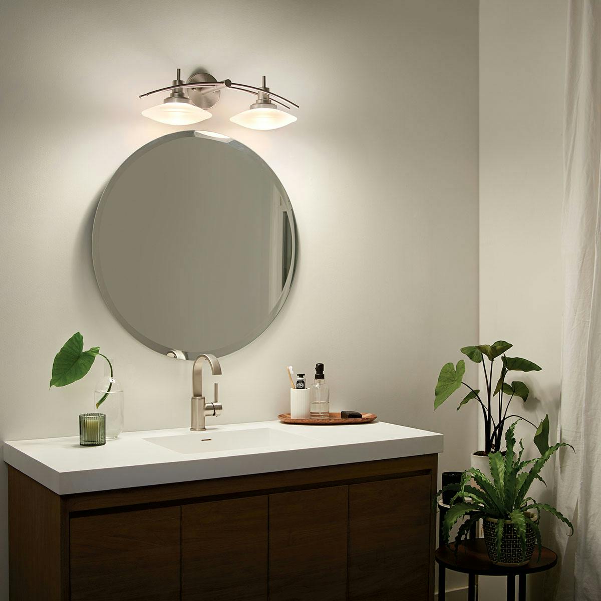 Night time bathroom image featuring Structures vanity light 6162NI