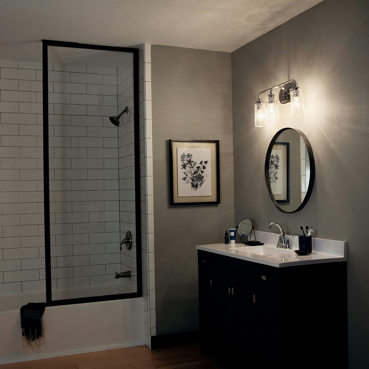 Night time Bathroom featuring Braelyn vanity light 45459CH