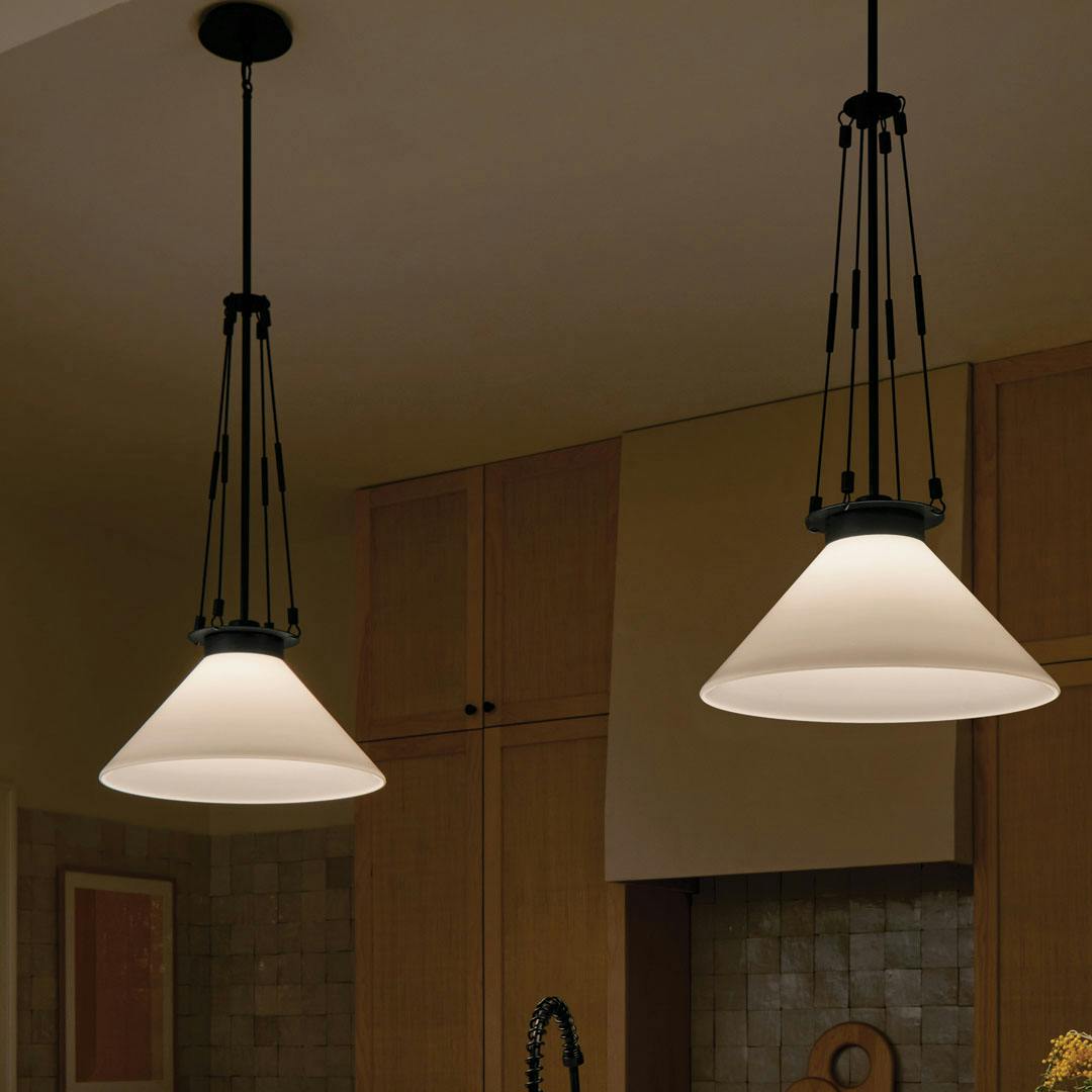 Night time kitchen with the Albers 18.25 Inch 1 Light Pendant with Opal Glass in Black