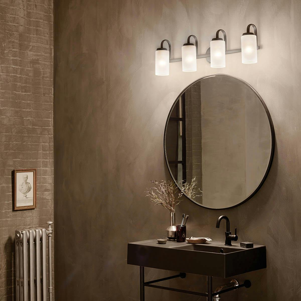 Night time bathroom with Kennewick 4 light vanity light in black